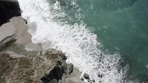 Californian Big Sur rugged coastline, waves crashing against shoreline, aerial