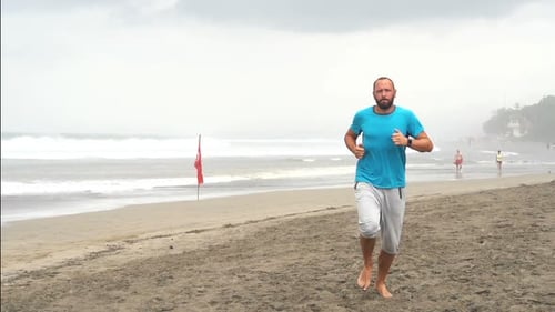 Young Sportive Male Jogging on Beach, Super 240