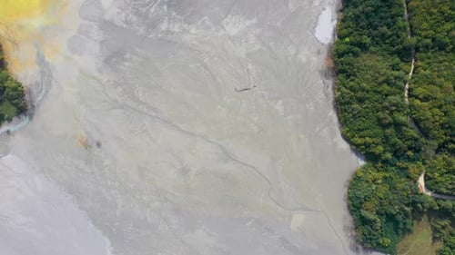 Aerial abstract pattern of acid mine drainage and mud, nature pollution, ecological bomb