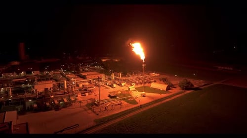 The Radiant Light from Gas Flaring Brightens the Nearby Surroundings - Aerial Drone Shot
