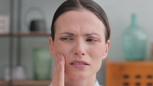 Close up of Woman with Toothache at Home