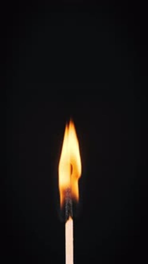 Burning Matchstick Close Up in Darkness