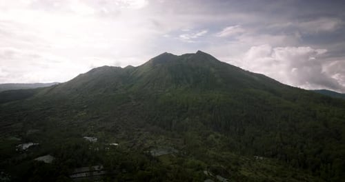 Mount Batur or Gunung Batur, active volcano on Bali island, Indonesia. Aerial forward