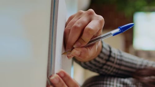 Vertical Video Remote Worker Writing Info on Paper Using Pen Close Up Shot