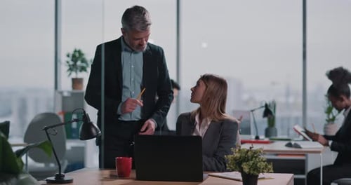 Caucasian Couple of Colleagues Discussing Business Idea in Creative Office Busy Serious Blonde Adult