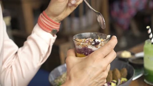 Woman Eating Tasty Dessert Sitting In Cafe