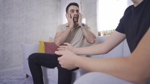 Distressed Man Receives Comforting Support from Friend