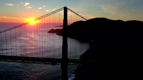 Golden Gate Bridge sunset aerial view over San Francisco bay waters
