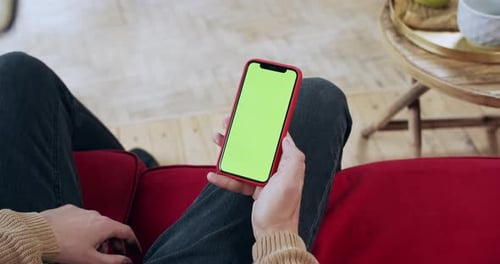 Man Relaxing on Couch Uses Phone with Green Screen
