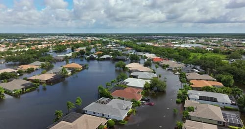 Flooded Houses and Cars From Hurricane Rainfall Water in Florida Residential Community Aftermath of