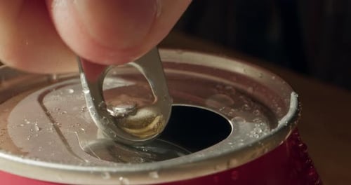 Opening Soda or Beer Can Macro Close Up of Can Pull Tab Opening Watering Refreshment Hand Open