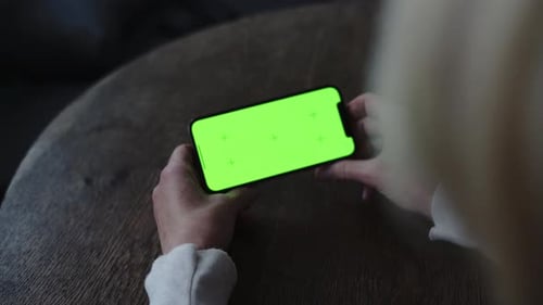 Mature Woman Hands with Smartphone Green Screen