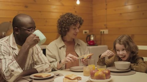 Family Enjoys Breakfast Together at Home