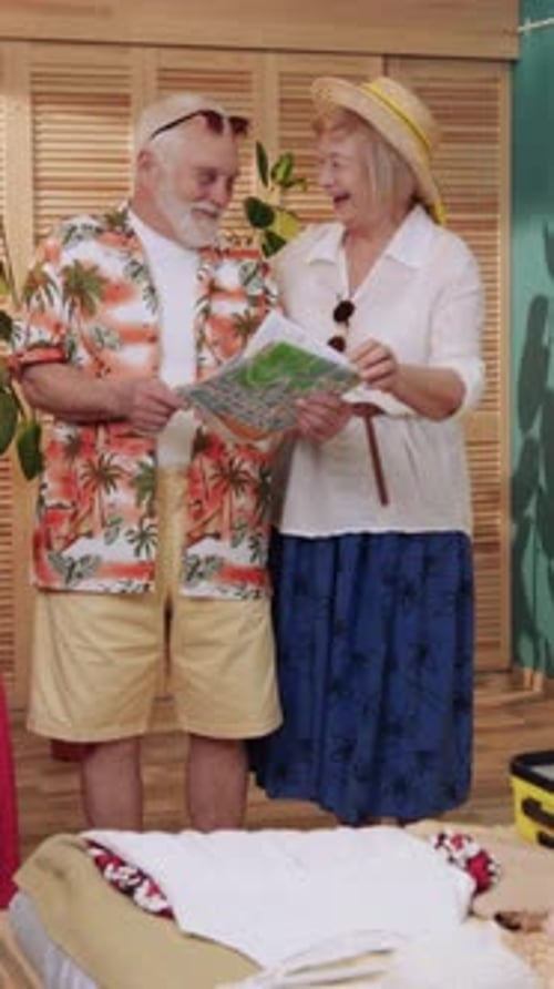 Senior Couple Planning Vacation with Map