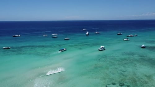 Boats and speedboats near the beautiful Saona Island, Dominican Republic