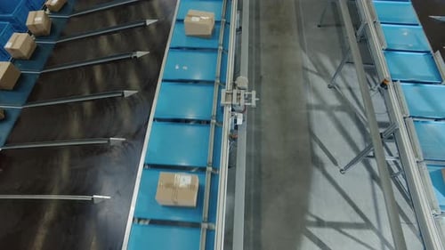 Parcels are Moving on Belt Conveyor at Post Sorting Office. Top Down View.