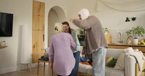 Three Generations Dancing in Living Room Having Fun
