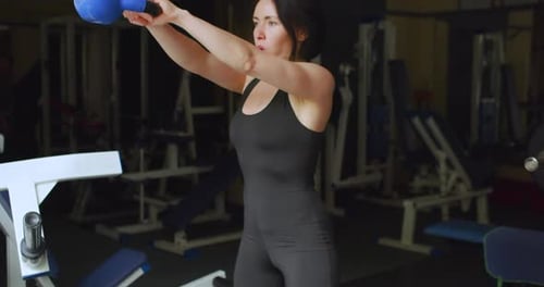 Close Up of a Female Athlete Exercising with Kettle Bell Heavy Workout with Kettle Bell