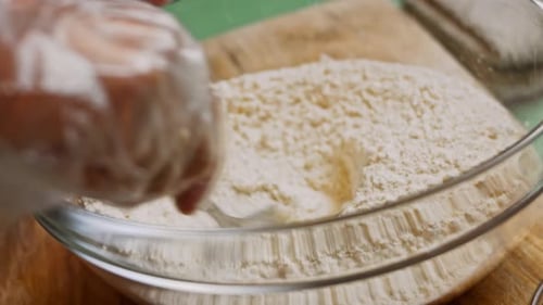 Mixing Flour in Glass Bowl for Dough