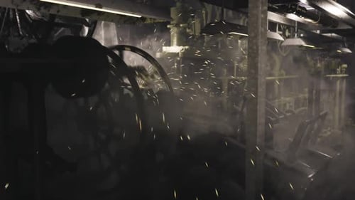 Industrial Machinery Operates in a Dimly Lit Factory Setting with Sparks Flying