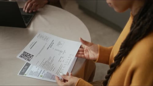 Young Couple Paying Utility Bills Online Using Laptop
