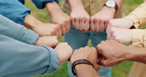 Fist bump, hands together and teamwork in synergy or huddle for university education or study