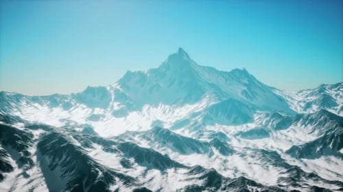 Aerial Flyover Over Majestic Snow-Capped Mountains