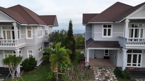 Aerial View of Modern Luxury Homes with Lush Gardens