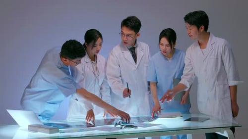 Medical Team Analyzing X-Rays in Futuristic Workplace