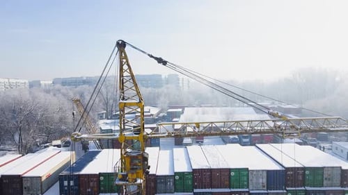 Shipping Container and Cargo Crane at Storage Yard at Winter Time Aerial View