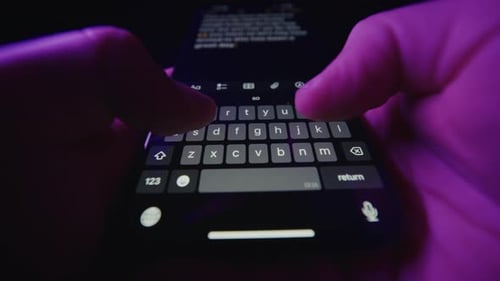 Typing Notes On Phone With Word Suggestions And Purple Ambient Lighting