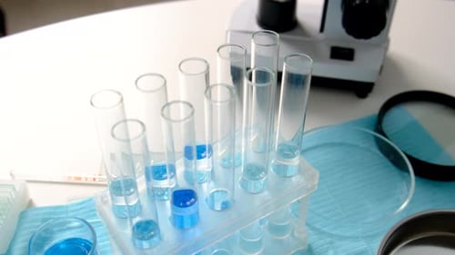 Lab Equipment with Test Tubes and Microscope