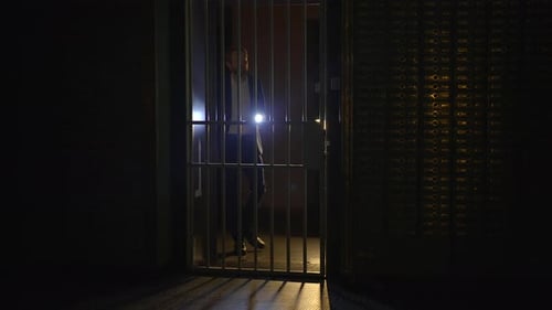 Detective Investigator Observing Hidden Room Suspense Thriller Scene
