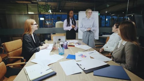 Smiling Colleagues in Meeting at the Office