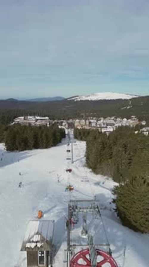 Alpine Ski Lift Aerial Drone View in Kopaonik Serbia Chairlift at Ski Resort Mountain Winter Forest