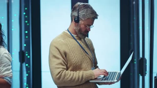 Skilled Tech Professionals Working Successfully in a Contemporary Data Center Environment