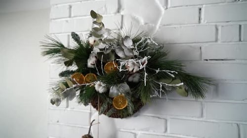 Christmas tree wreath with decorations on the wall in the restaurant