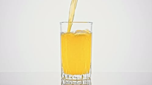 Fresh Juice Being Poured Into a Glass