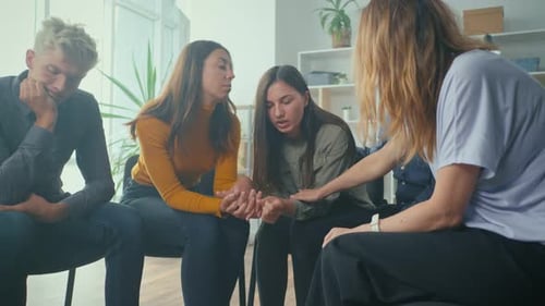 Friends Offer Comfort and Support in Group Meeting