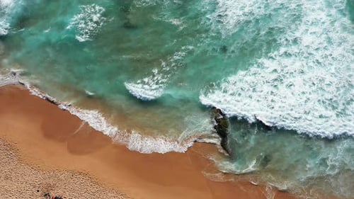 Aerial Drone View of Scenic Sea Waves Crashing on Sandy Shore