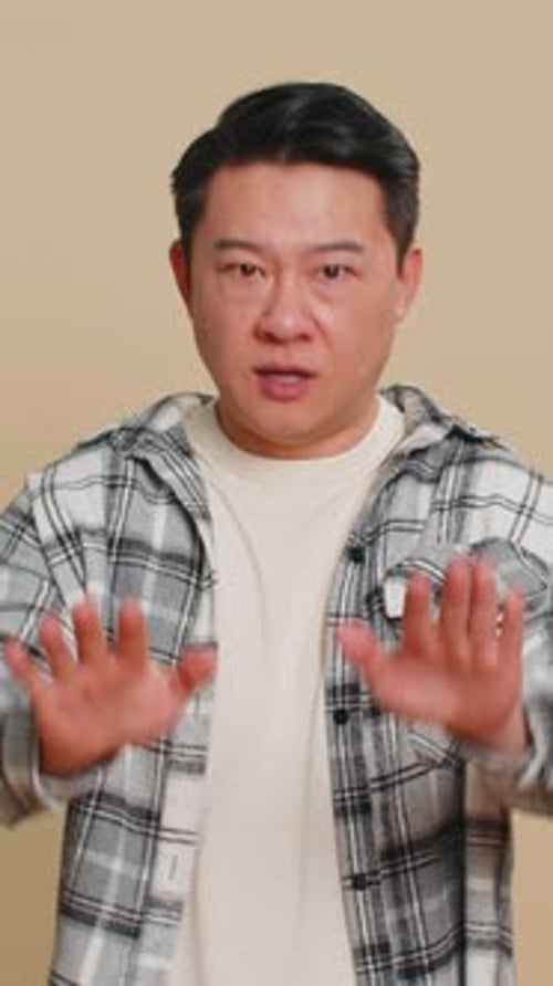 Man gestures no with hands and finger, portrait