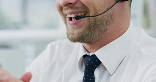 4k video footage of a young call centre agent working in an office