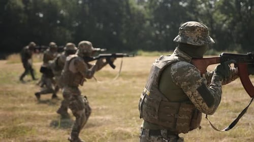 The Military Special Forces Unit Attacks the Enemy with Ammunition and Weapons on the Battlefield