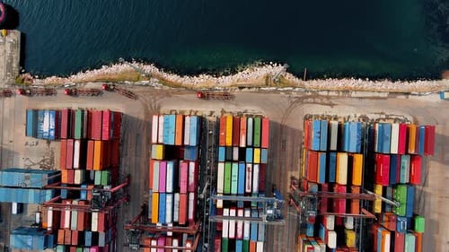 Aerial View of a Busy Shipping Port and Containers