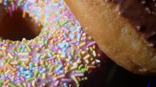 Delicious glaze donut homemade tasty mixed sprinkles toppings sweet food close-up
