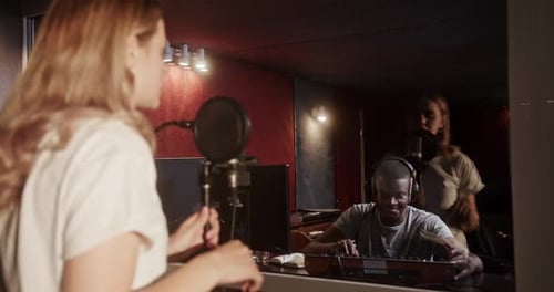 Musicians Recording Song in Sound Studio