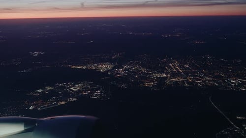 Airplane flying over city