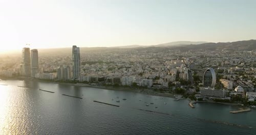 Dusk Descends on Limassol Aerial Vista of City Lights and Coastal at Sunset