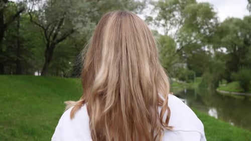 Blond Woman Head Walking Back View
