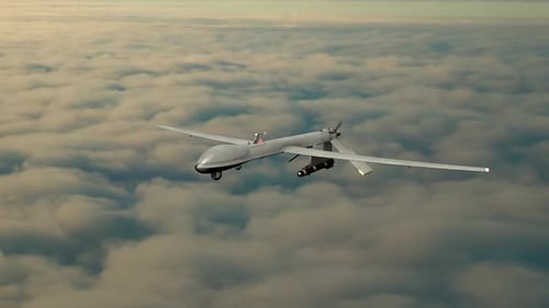 Military Surveillance Drone Flying High Above Clouds